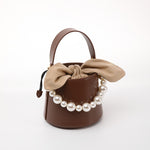 Load image into Gallery viewer, Smting | Small Leather Bucket Bag with Knot and Pearl details