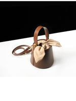 Load image into Gallery viewer, Smting | Small Leather Bucket Bag with Knot and Pearl details
