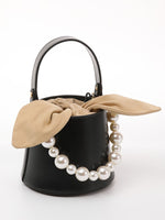 Load image into Gallery viewer, Smting | Small Leather Bucket Bag with Knot and Pearl details
