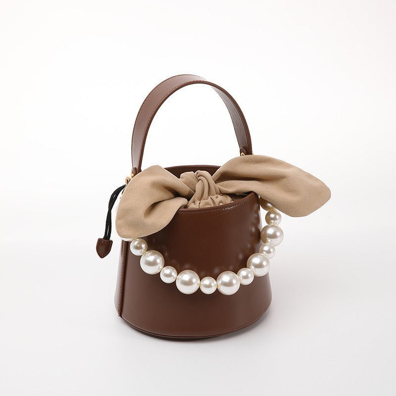 Smting | Small Leather Bucket Bag with Knot and Pearl details